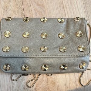 Small clutch or gold metal strap handbag